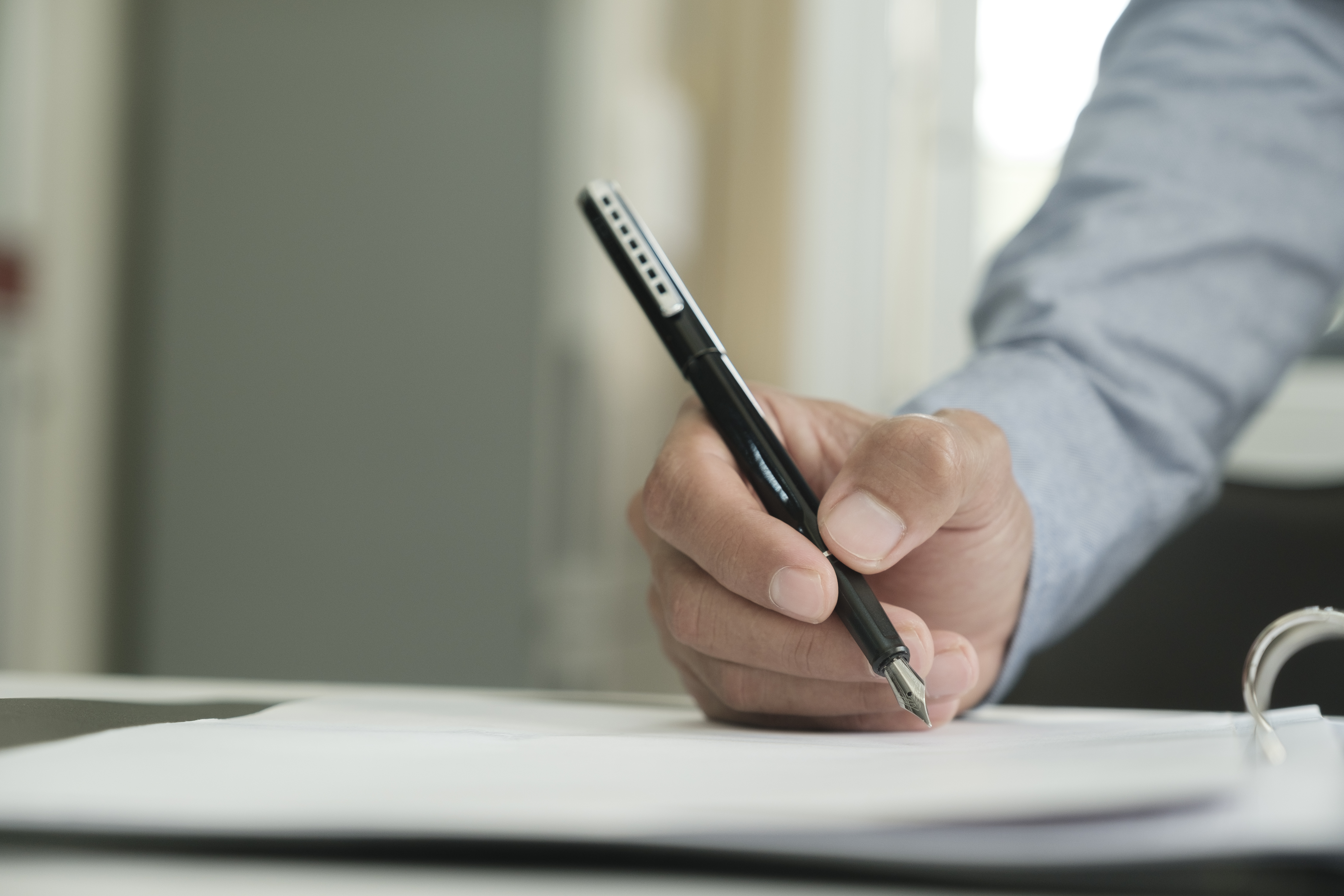 Close Up Of Businessman Signing A Contract.