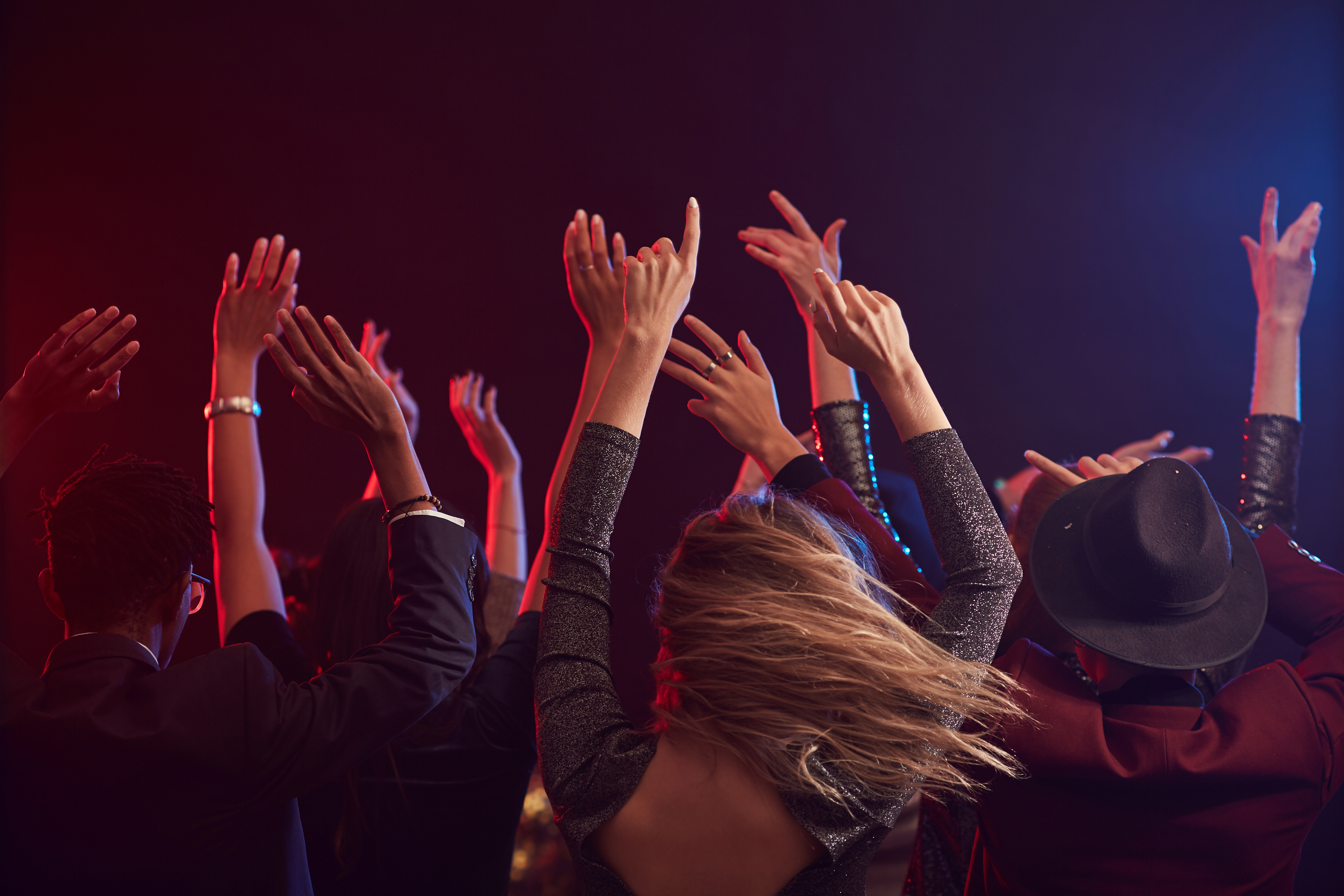 Back view of young people Raising hands 