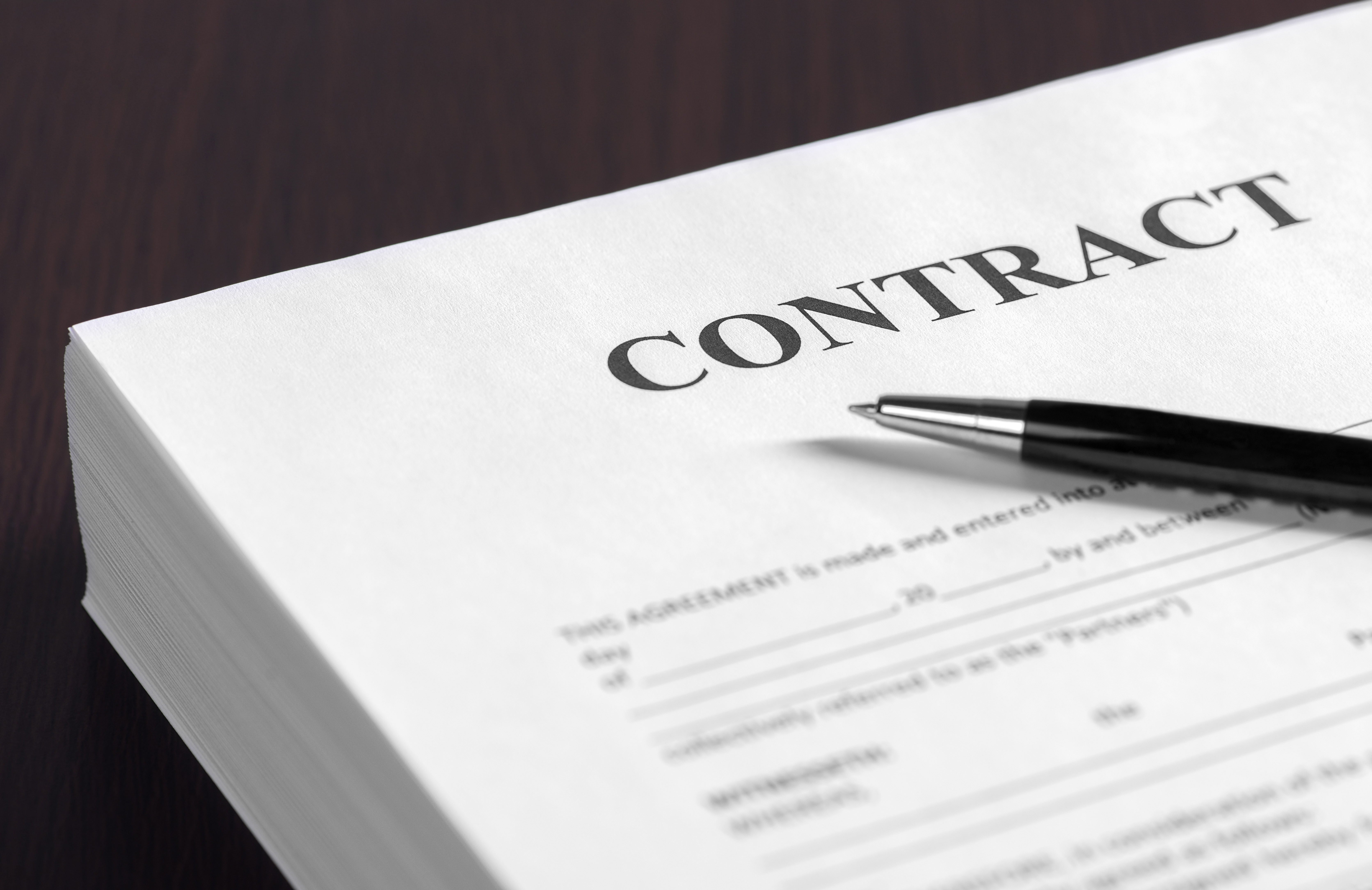 The contract on desktop, selective focus image on sign a contract